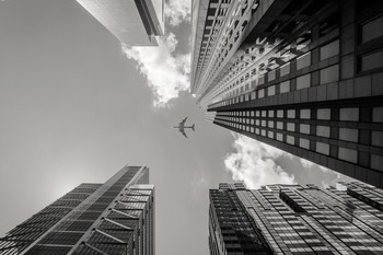 buildings city plane sky